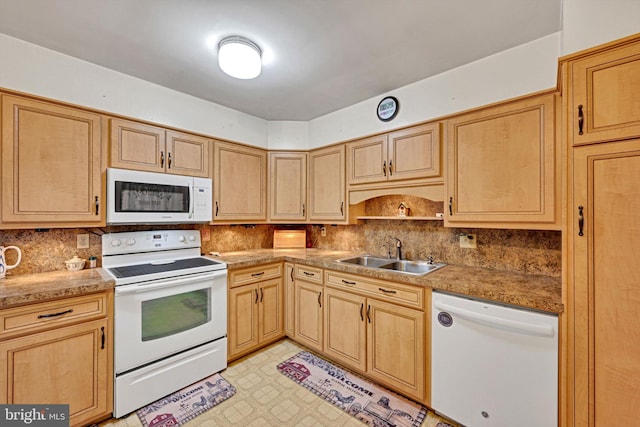 kitchen featuring light brown cabinets, white appliances, tasteful backsplash, and sink