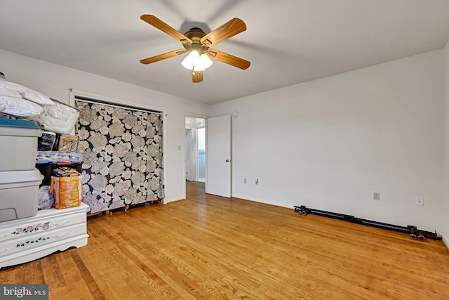 interior space featuring light hardwood / wood-style floors and ceiling fan