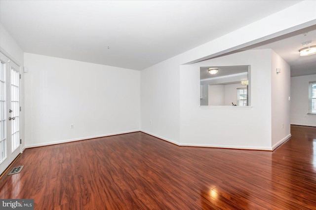 empty room featuring hardwood / wood-style flooring and plenty of natural light