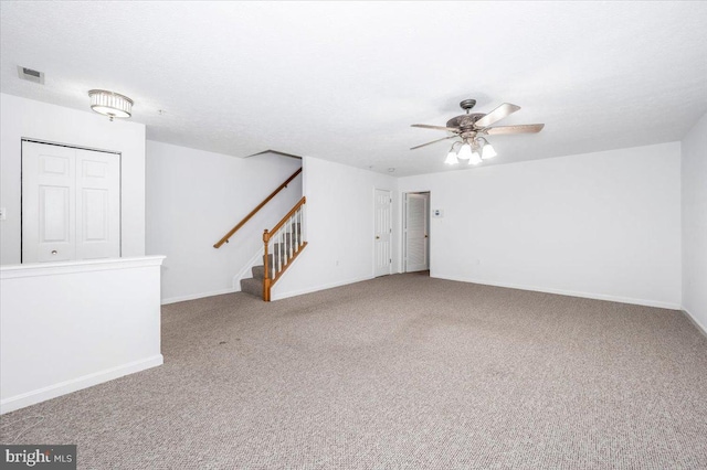 carpeted empty room with ceiling fan