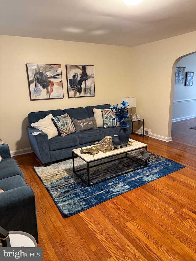 living room featuring dark hardwood / wood-style flooring