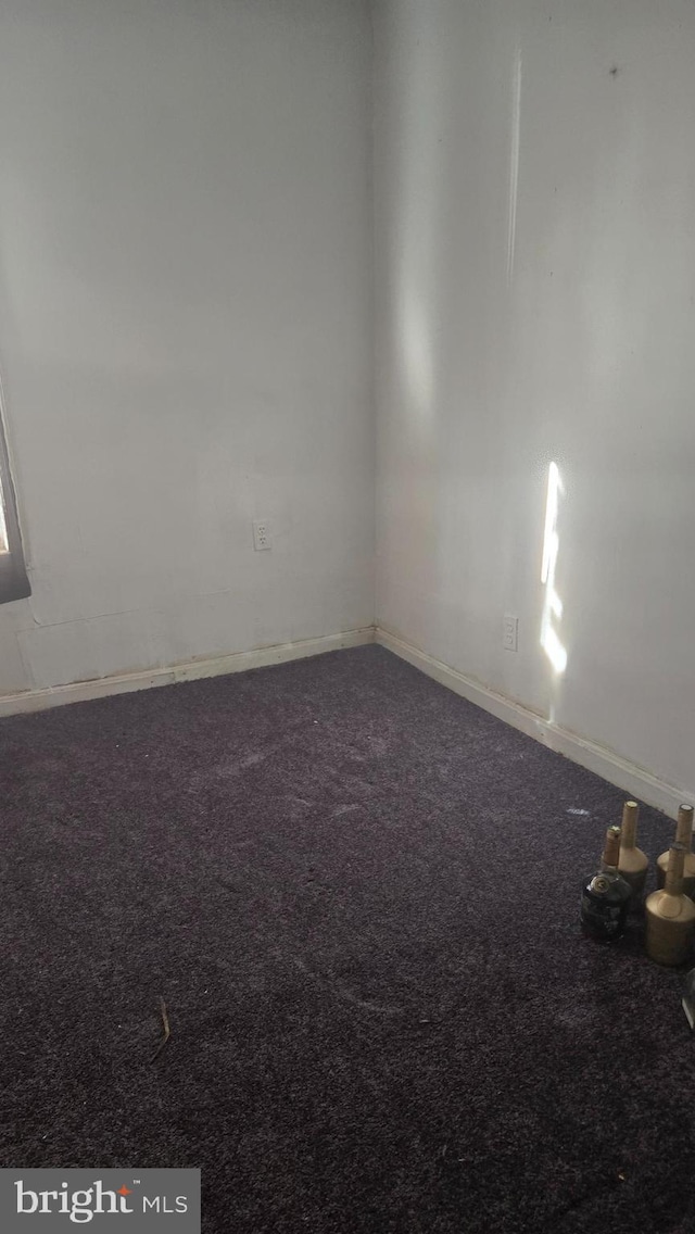 empty room with carpet flooring