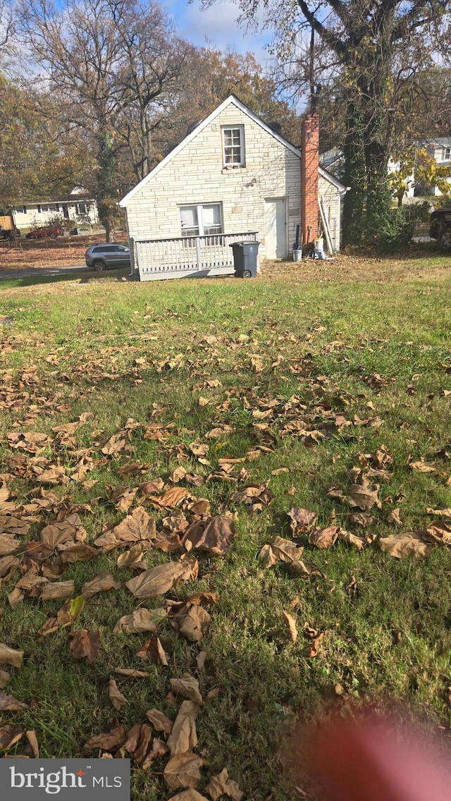 view of home's exterior with a lawn