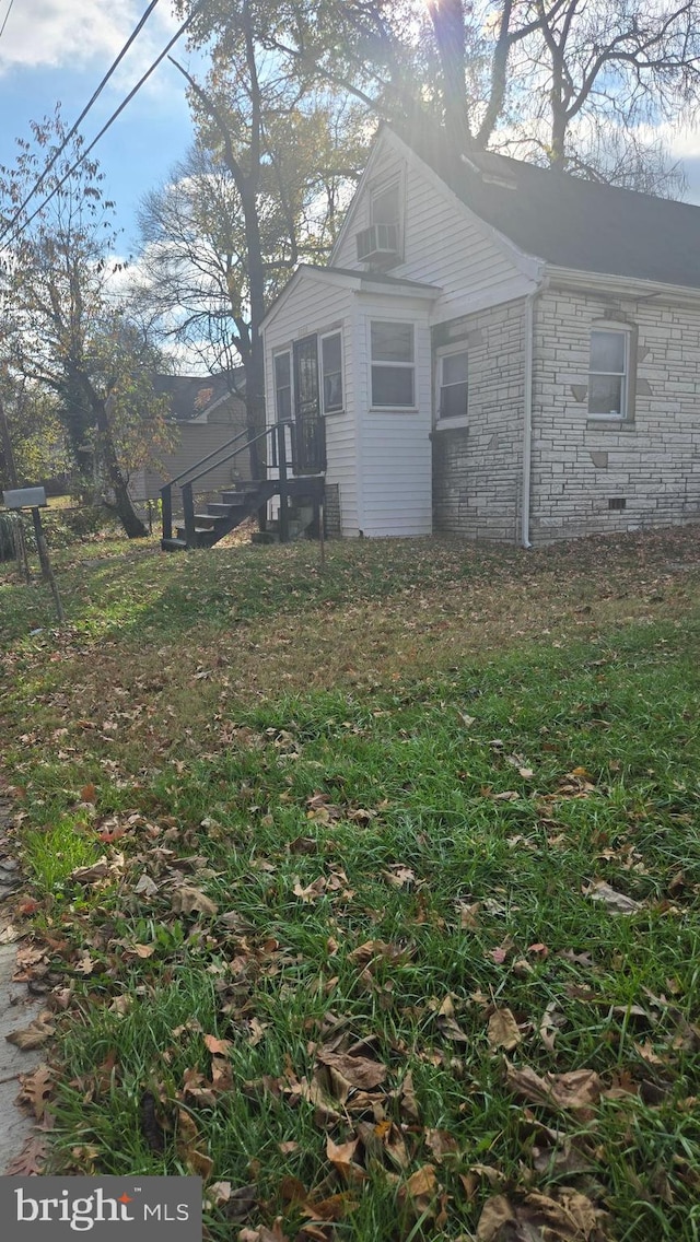 view of property exterior featuring a yard