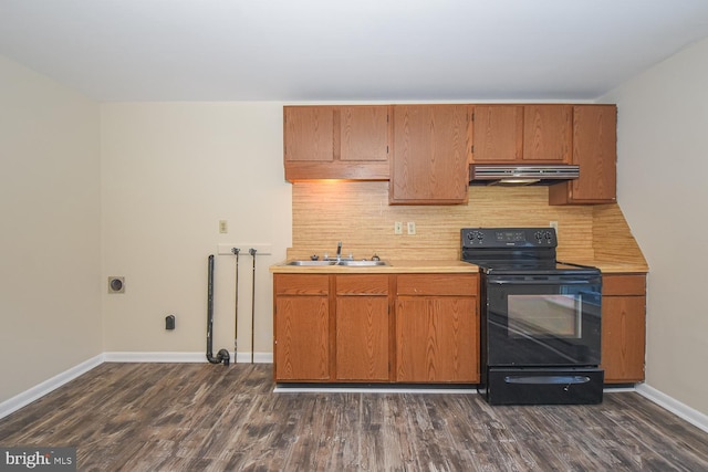 kitchen featuring backsplash, black range with electric stovetop, dark hardwood / wood-style flooring, and sink