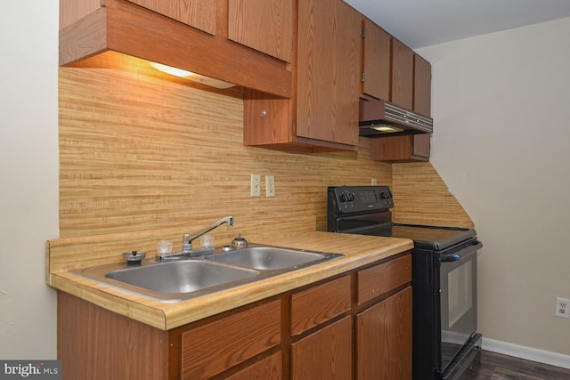 kitchen with black range with electric stovetop, decorative backsplash, sink, and dark hardwood / wood-style floors