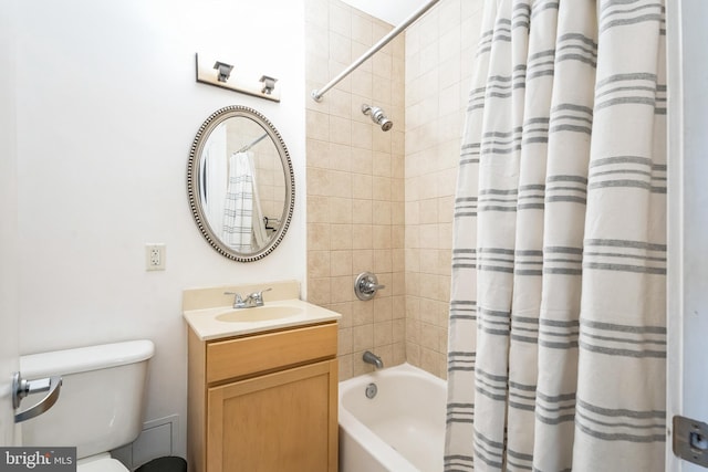 full bathroom featuring shower / bath combination with curtain, toilet, and vanity