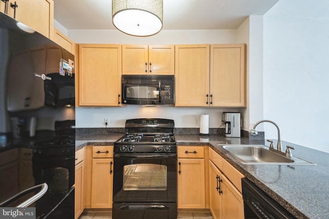 kitchen with light brown cabinetry, sink, light tile patterned floors, and black appliances