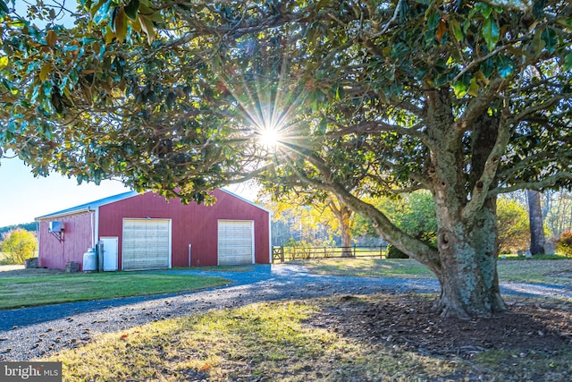 view of outdoor structure featuring a yard and a garage