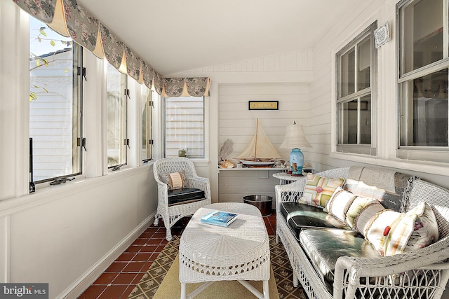 sunroom / solarium with vaulted ceiling