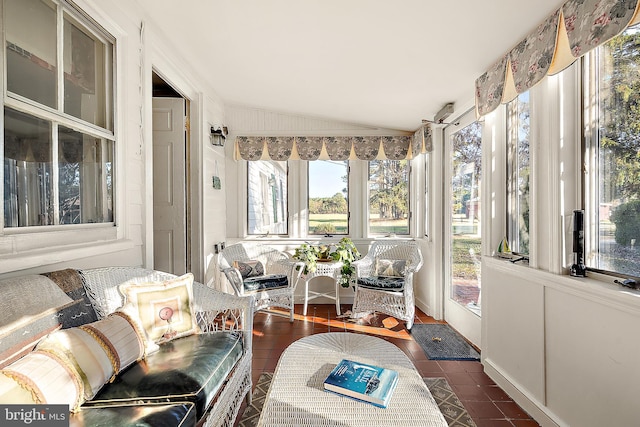 sunroom featuring vaulted ceiling