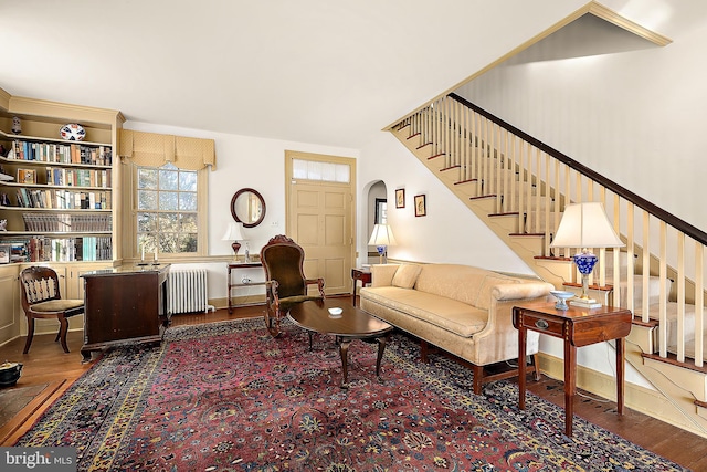 living room featuring radiator heating unit and wood-type flooring