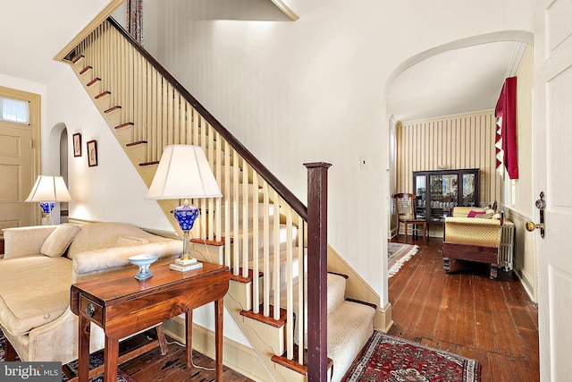 stairway with hardwood / wood-style flooring