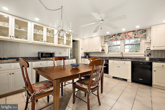 kitchen featuring white cabinets, dishwasher, light tile patterned floors, and sink