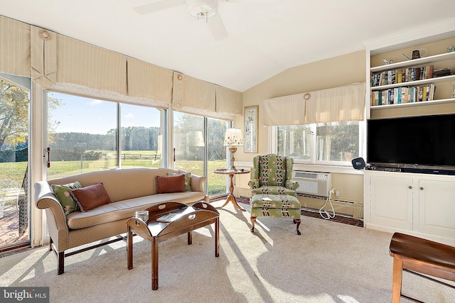 sunroom / solarium with a wall unit AC, ceiling fan, and lofted ceiling