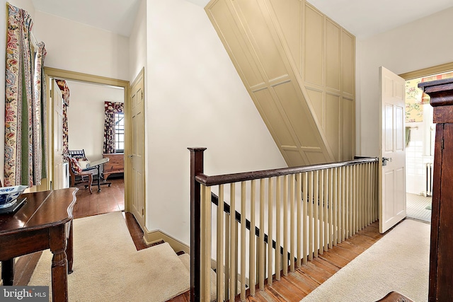 corridor with light hardwood / wood-style floors