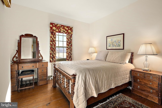 bedroom featuring dark hardwood / wood-style flooring