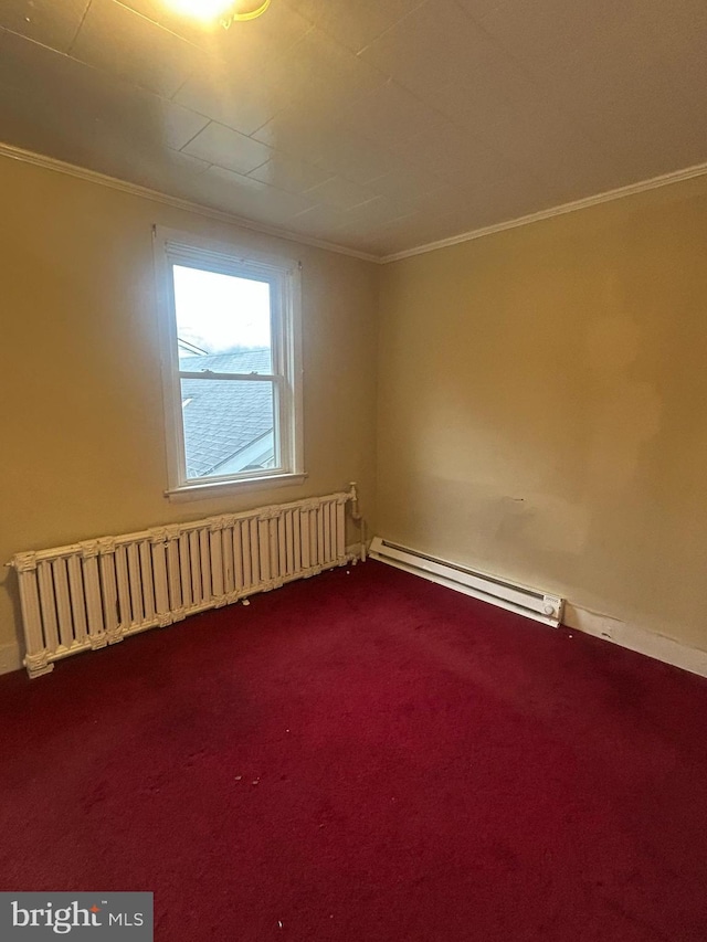 carpeted empty room with crown molding, radiator heating unit, and baseboard heating