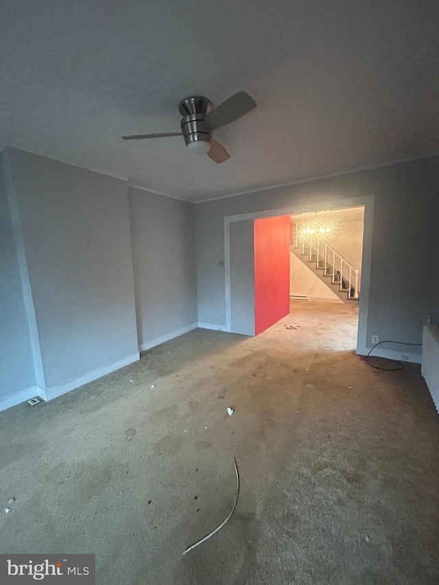 interior space featuring ceiling fan and concrete floors