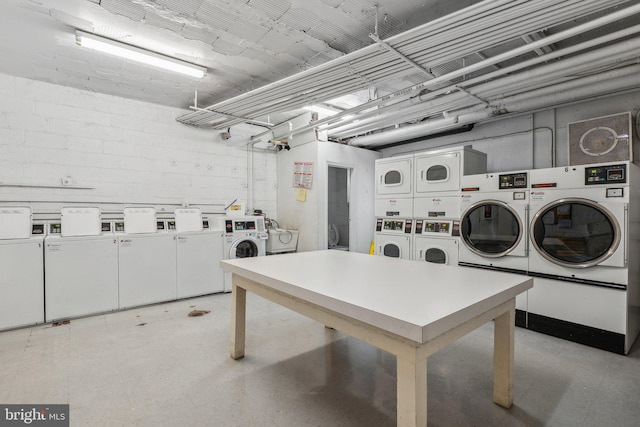 laundry room with stacked washer / dryer and washer and dryer