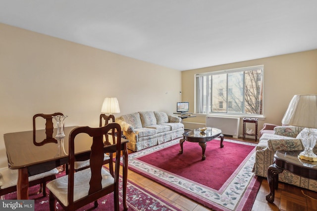 living room with hardwood / wood-style flooring and radiator