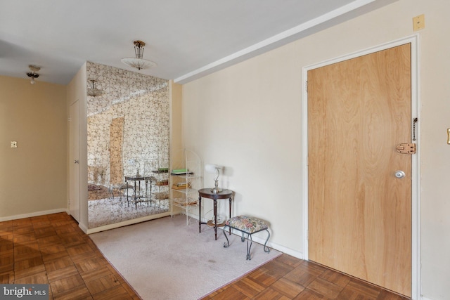 entrance foyer featuring dark parquet floors