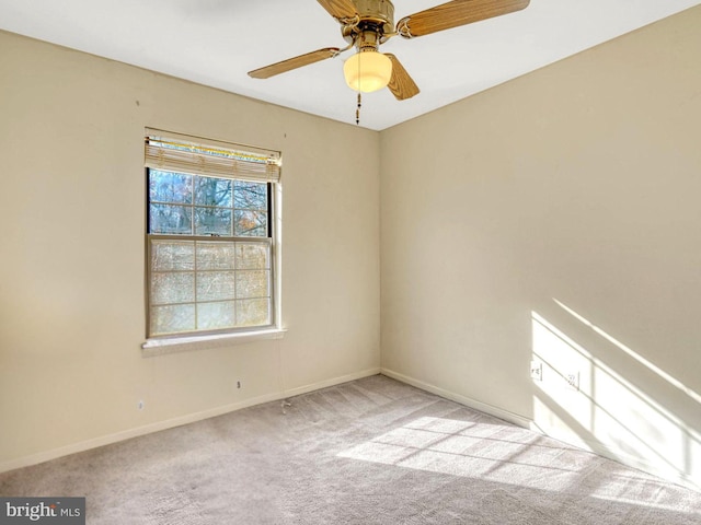 unfurnished room with light carpet and ceiling fan