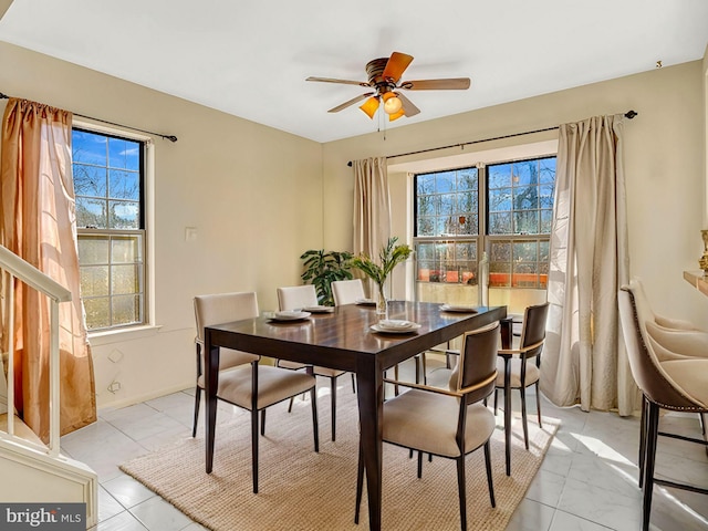 dining space featuring ceiling fan