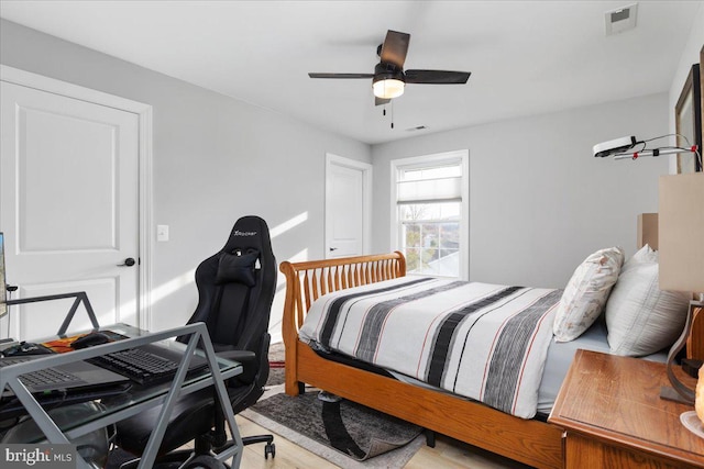 bedroom featuring ceiling fan and light wood-type flooring