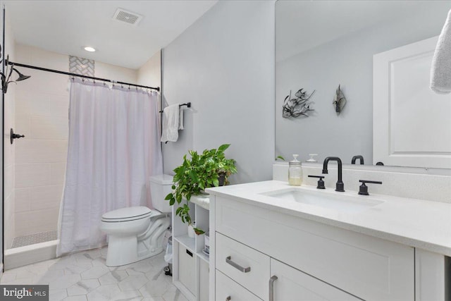 bathroom with a shower with shower curtain, vanity, and toilet