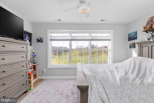 bedroom featuring ceiling fan and light hardwood / wood-style flooring