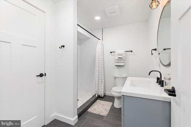 bathroom with curtained shower, tile patterned flooring, vanity, and toilet