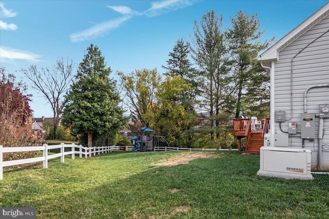 view of yard with a playground and a wooden deck