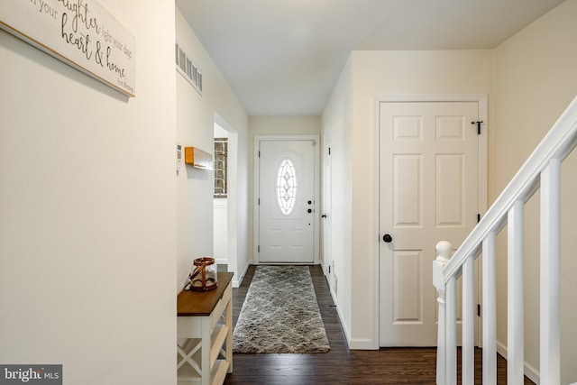 doorway to outside featuring dark hardwood / wood-style flooring