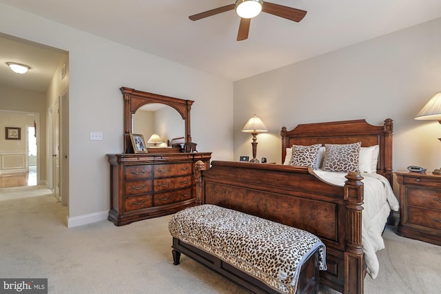 bedroom featuring ceiling fan and light colored carpet