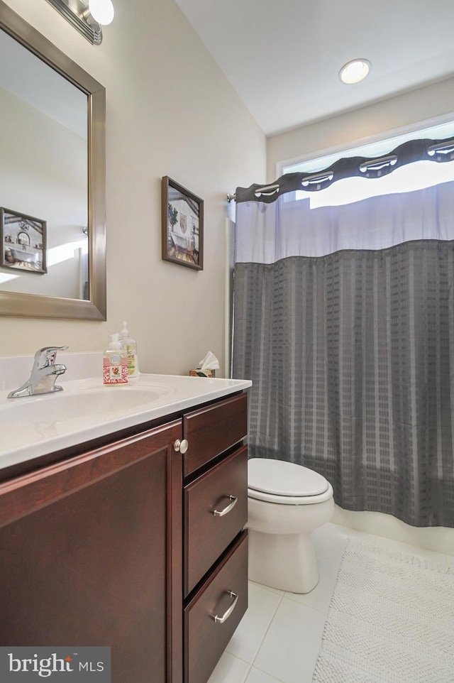 bathroom featuring tile patterned flooring, vanity, toilet, and a shower with curtain