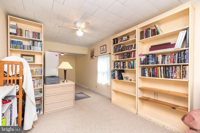 home office featuring baseboards, ceiling fan, and carpet floors