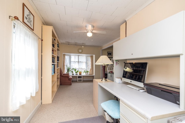 office space with light carpet and ceiling fan