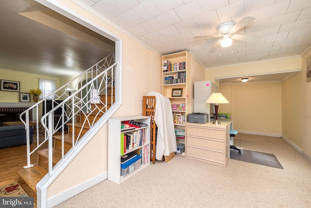 office area featuring baseboards, a ceiling fan, and ornamental molding