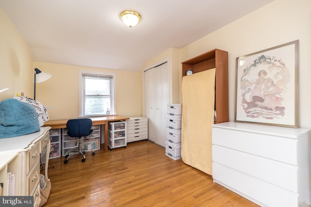 home office with wine cooler and light wood-style flooring