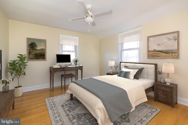 bedroom featuring multiple windows, light wood-style flooring, baseboards, and ceiling fan