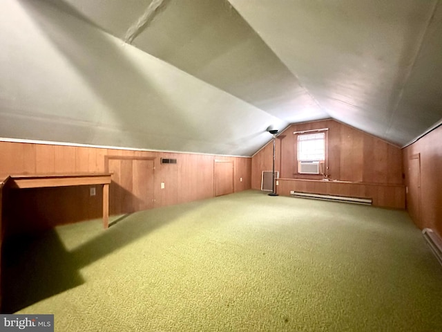 additional living space featuring carpet, wood walls, lofted ceiling, cooling unit, and baseboard heating