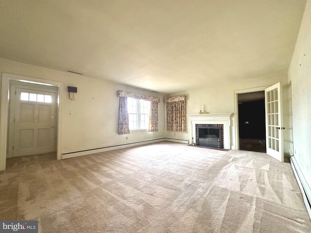 unfurnished living room featuring a fireplace, light colored carpet, and baseboard heating