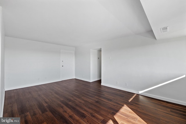 unfurnished room featuring dark hardwood / wood-style floors