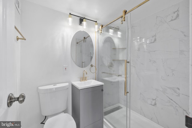 bathroom with vanity, toilet, and an enclosed shower