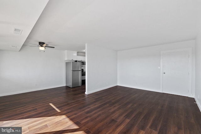 unfurnished living room with dark hardwood / wood-style floors and ceiling fan