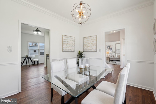 dining space featuring ornamental molding, baseboards, an inviting chandelier, and wood finished floors