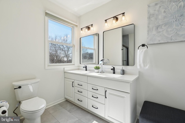 full bathroom featuring tile patterned flooring, a sink, toilet, and double vanity