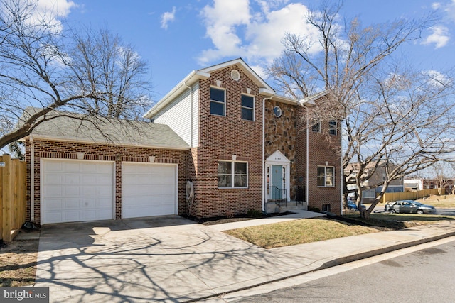 traditional-style home with concrete driveway, brick siding, fence, and an attached garage