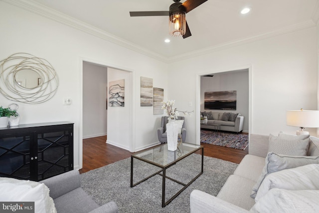 living area with ornamental molding, recessed lighting, and wood finished floors